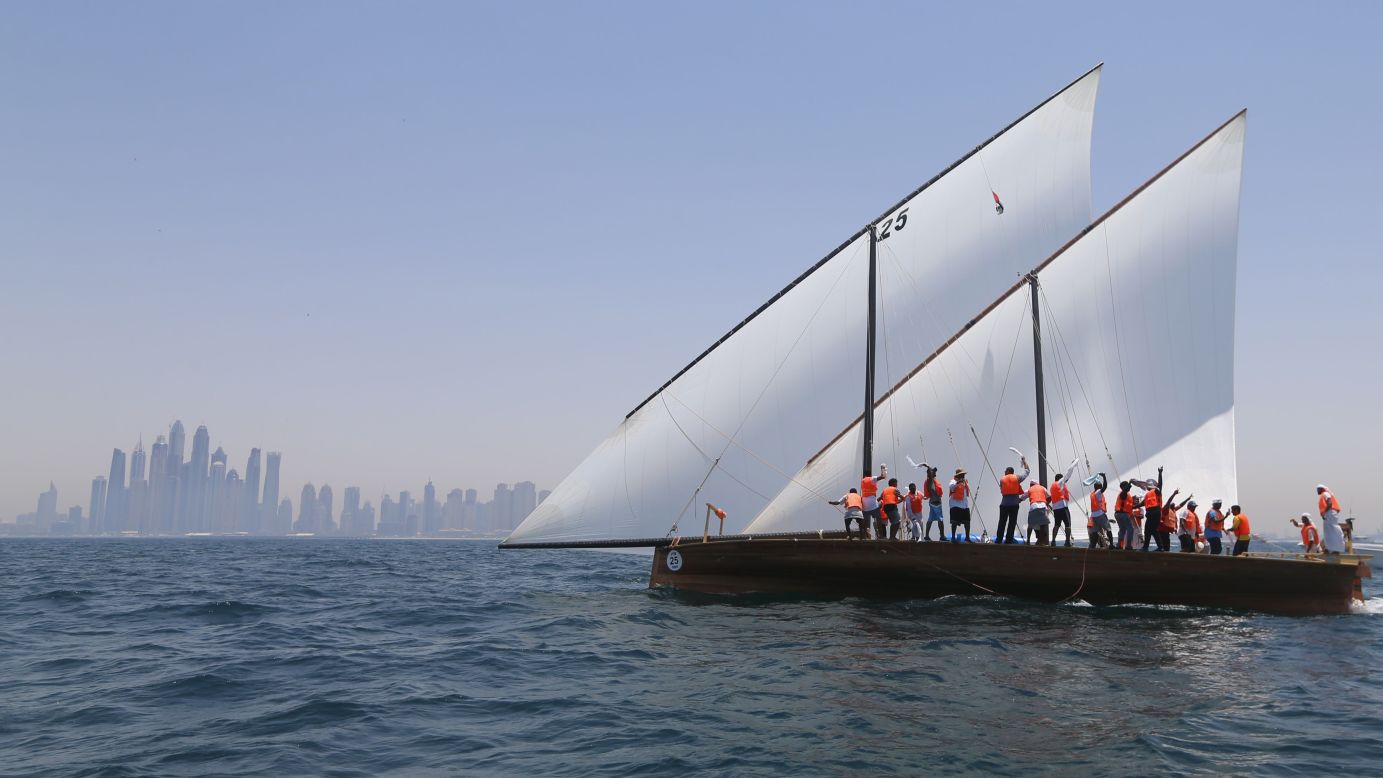 Sailors aboard the Zilzal celebrate after winning the Al Gaffal Dhow Race near Dubai, United Arab Emirates, on Friday, May 20.