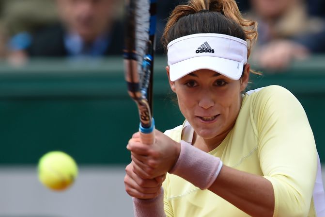 Garbine Muguruza, the 2015 Wimbledon finalist, rallied to defeat Anna Karolina Schmiedlova 3-6 6-3 6-3. 