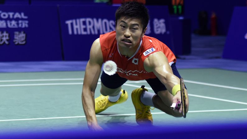 Japan's Sho Sasaki dives for a shot Wednesday, May 18, during a Thomas Cup badminton match in Kunshan, China.