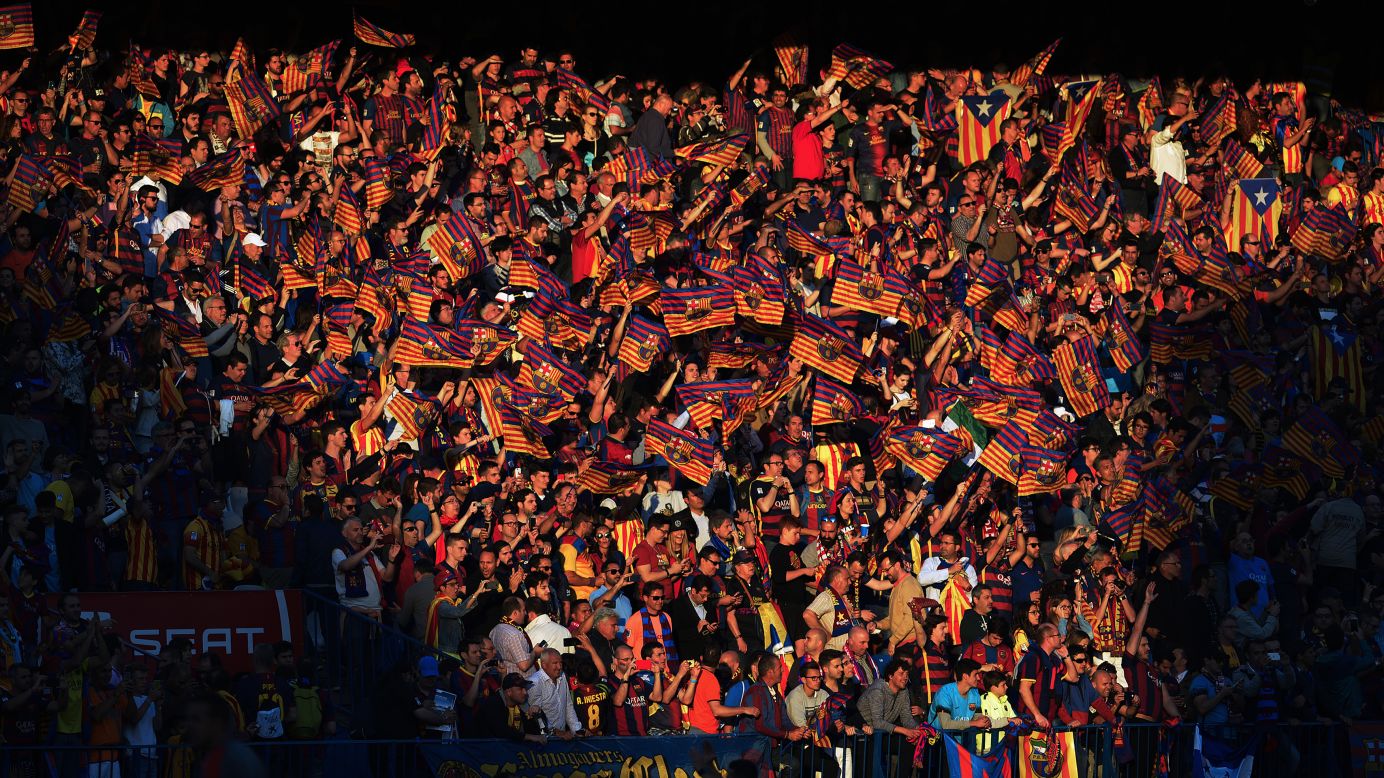 Barcelona fans wave flags before the Copa del Rey (King's Cup) final in Madrid on Sunday, May 22. The Spanish league champions defeated Sevilla 2-0 to complete the domestic double.