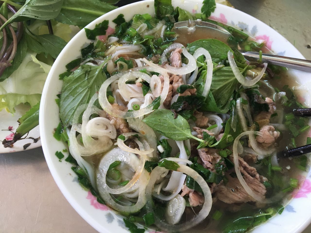 It's almost impossible to walk a block in Vietnam's major cities without bumping into a makeshift pho stand. This staple consists of a salty broth, fresh rice noodles, a sprinkling of herbs and chicken or beef. 