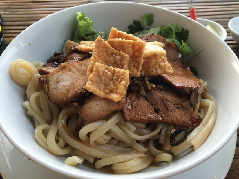 This pork noodle dish from Hoi An is a bit like the various cultures that visited the trading port at its prime. The thicker noodles are similar to Japanese udon, the crispy won-ton crackers and pork are a Chinese touch, while the broth and herbs are clearly Vietnamese.