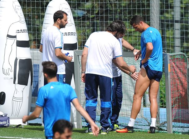 The Portuguese forward was pictured receiving treatment on his left thigh ...