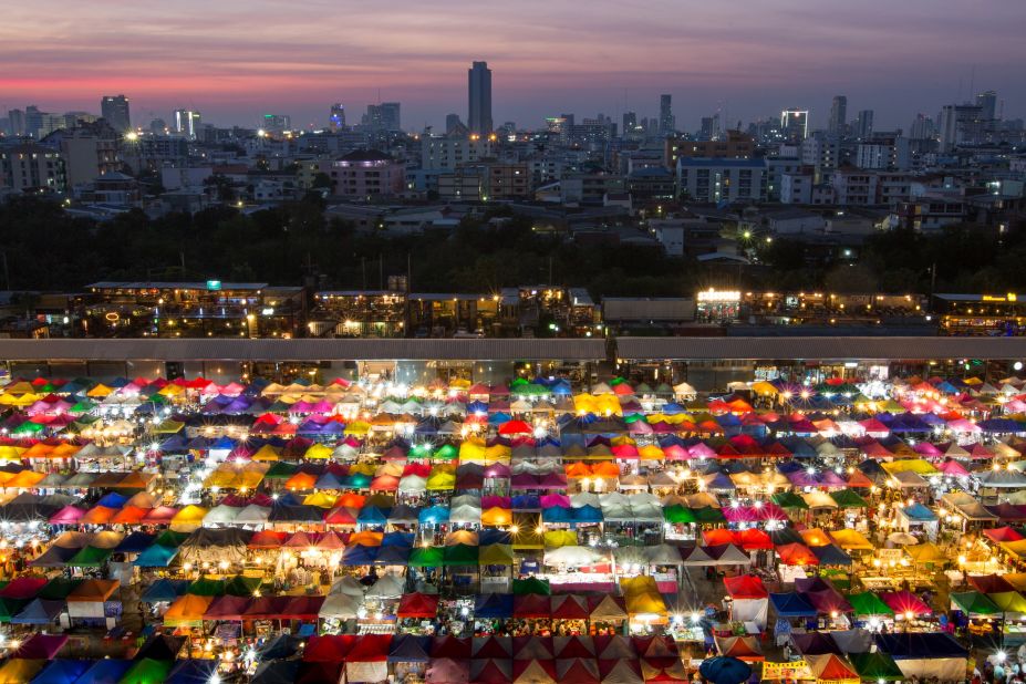 A rainbow of a different kind is created by the back-lit canopies of this colorful night market in Bangkok, taken by Kajan Madrasmail. (<a href="http://travel.nationalgeographic.com/photographer-of-the-year-2016/" target="_blank" target="_blank">Click here to enter NatGeo photo contest</a>)