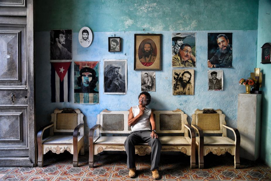 Romaine W says he was drawn to this museum-like house in Havana. "As Cubans are always welcoming to guests I decided to take a peek inside, only to find out that this was actually a home containing collectible items from vinyl records to a large scale American flag, then to this wall of icons; decorated with a Cuban flag, revolutionary fighters and past and present Cuban leaders." (<a href="http://travel.nationalgeographic.com/photographer-of-the-year-2016/" target="_blank" target="_blank">Click here to enter NatGeo photo contest</a>)