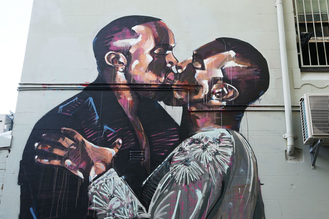 A mural showing hip-hop artist Kanye West kissing himself appeared in Sydney, Australia. The artist, Scott Marsh, was inspired by a photo of West kissing his wife, Kim Kardashian-West. 