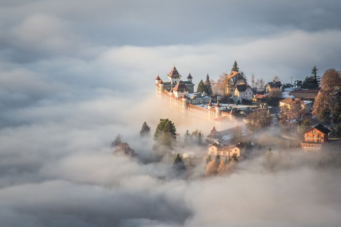Boukhechina Malik climbed above low clouds to shoot this image in Sonchaux, Switzerland. "I thought I was immersed in a fairytale, out of every human scale." (<a href="http://travel.nationalgeographic.com/photographer-of-the-year-2016/" target="_blank" target="_blank">Click here to enter NatGeo photo contest</a>)