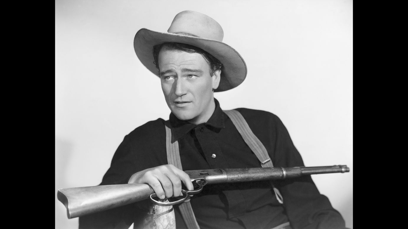 John Wayne holds a rifle in this publicity photo taken for the 1941 movie "The Shepherd of the Hills." The iconic actor, who starred in many popular Westerns and won an Academy Award for his role in "True Grit," was born on this day in 1907.