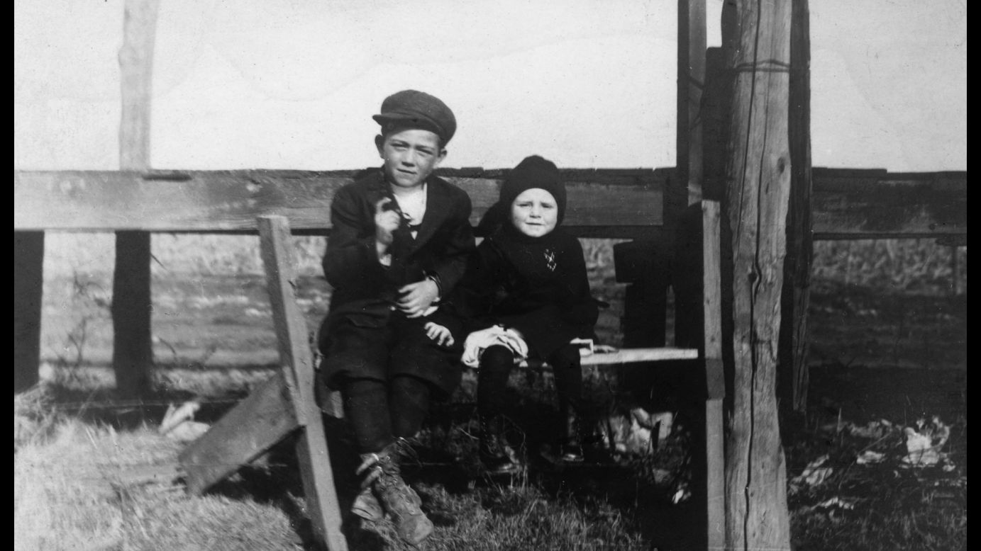 Wayne, left, sits with his younger brother Robert in this photo circa 1915. Wayne was born as Marion Morrison in Winterset, Iowa, but he preferred to go by his nickname "Duke" -- which was started by firefighters who always saw him with his Airedale dog of the same name. He would later take the name John Wayne for his acting career.