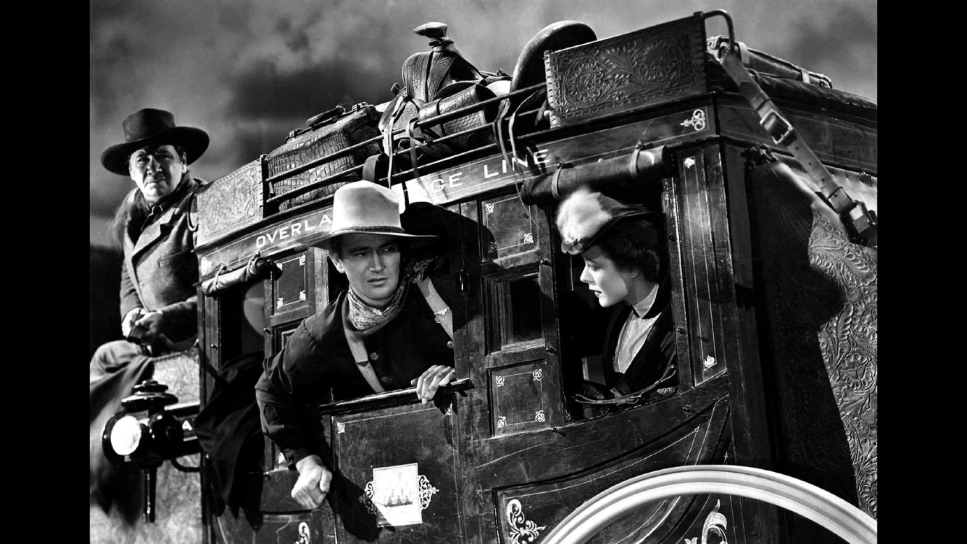 Wayne, center, appears on the set of the 1939 film "Stagecoach" with George Bancroft and Louise Platt. Wayne's "portrayals of men of duty, honor and courage, coupled with his own off-camera brand of personal true grit, endeared him to nearly three generations of Americans," wrote Robert Kistler of the Los Angeles Times.