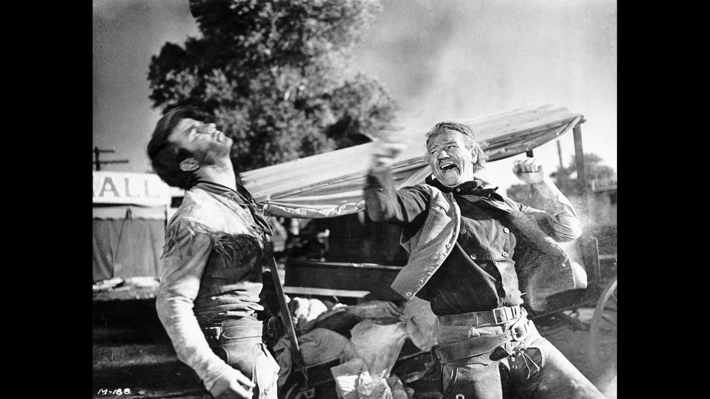 Wayne, right, acts out a fight scene for the 1948 film "Red River." "Mr. Wayne seemed the embodiment of those qualities of spirit and character that Americans aspired to and admired," wrote Martin Weil of the Washington Post. "They were the frontier virtues, as America knew them or believed them to be: energy, rugged honesty, self-reliance and a willingness -- above all, perhaps -- to fight for what he believed in."