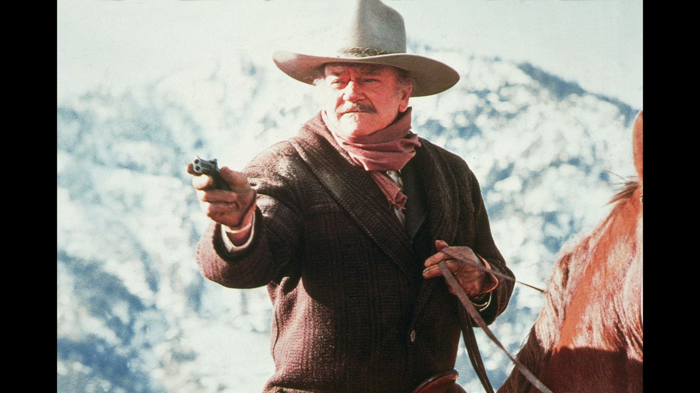 Wayne aims a gun during a scene from "The Shootist" in 1976. It was his last film. He was 72 years old when he died from stomach cancer in 1979. "In terms of longevity and popular appeal, both in the United States and elsewhere, there simply never was an actor like him," Kistler wrote then in the Los Angeles Times.