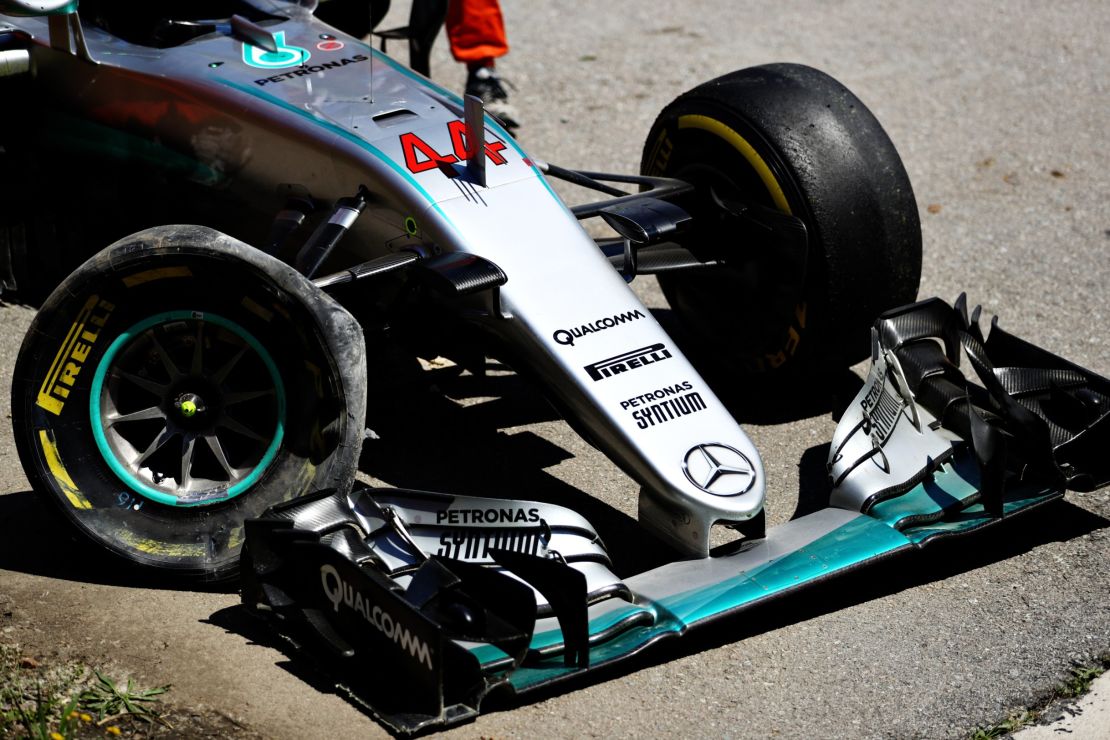Lewis Hamilton's battered Mercedes lies at the side of the Circuit de Barcelona-Catalunya. 