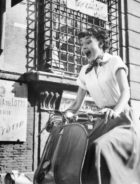 In 1953 Audrey Hepburn appeared astride a Vespa in "Roman Holiday", sending sales through the roof. 