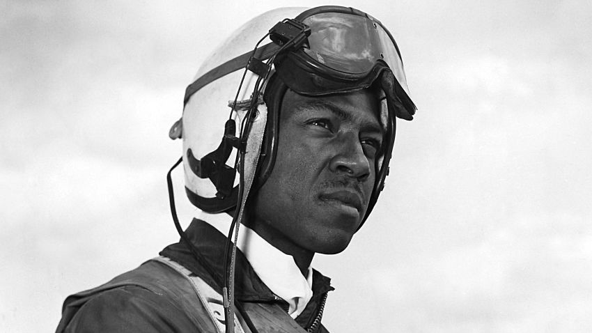 Navy aviator Jesse Brown standing on the deck of an aircraft carrier in North Korea. This photo of Brown, whose childhood hero was Olympic sprinter Jesse Owens, was taken for an Ebony magazine profile.