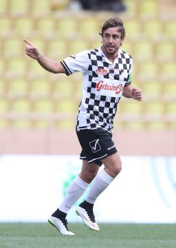 Fernando Alonso enjoys one of his goals in the pre-Monaco Grand Prix charity soccer match.