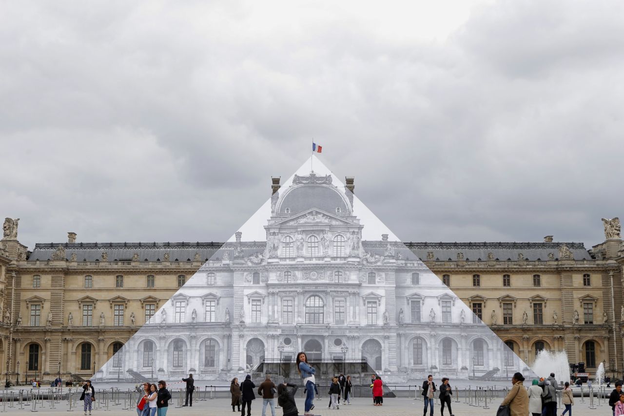 Previously, JR created this large-scale installation at Paris' Louvre Museum in May. 