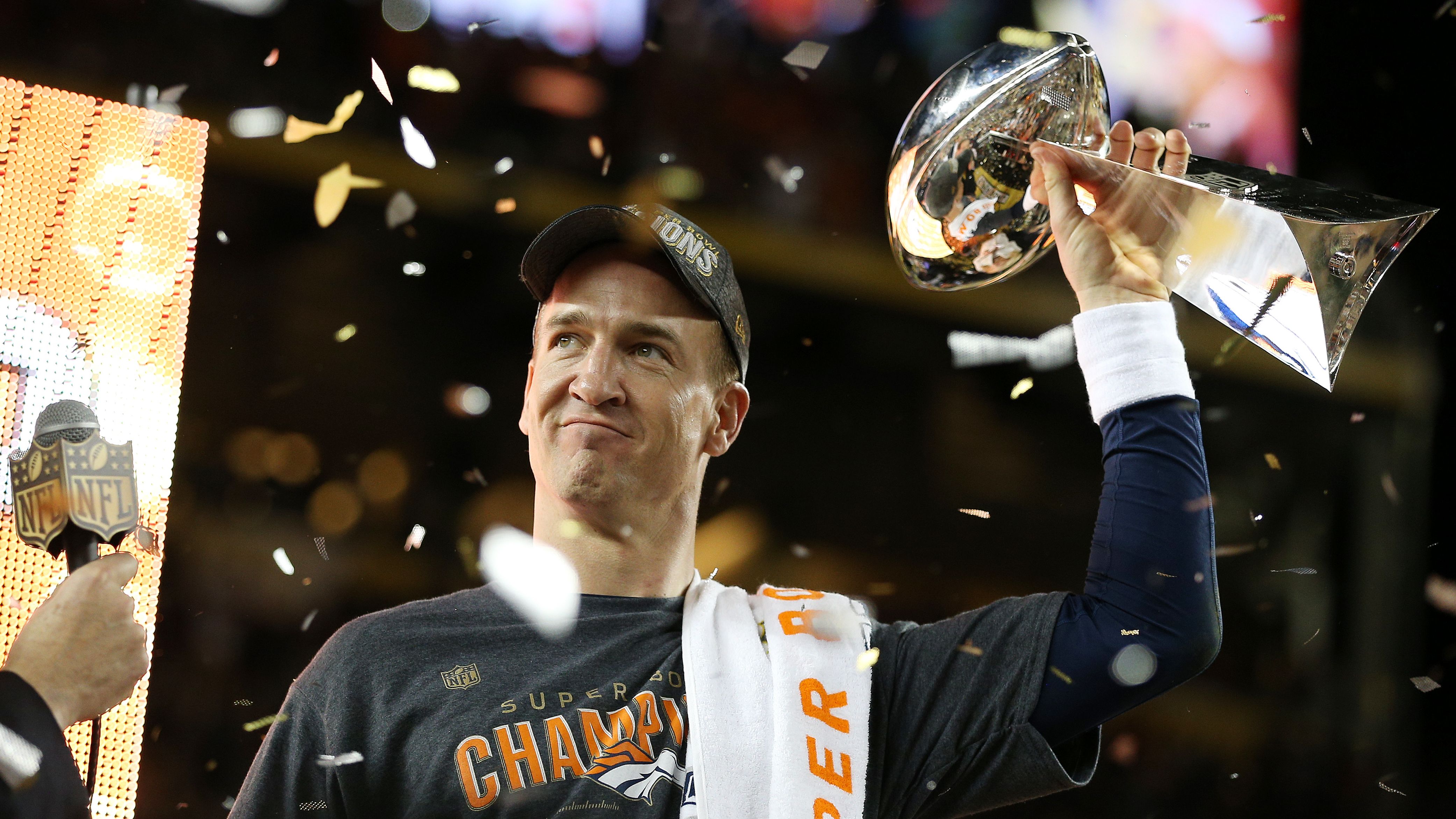 Peyton Manning #18 of the Denver Broncos celebrates with the Vince Lombardi Trophy after Super Bowl 50 at Levi's Stadium on February 7, 2016, in Santa Clara, California. The Broncos defeated the Panthers 24-10. 