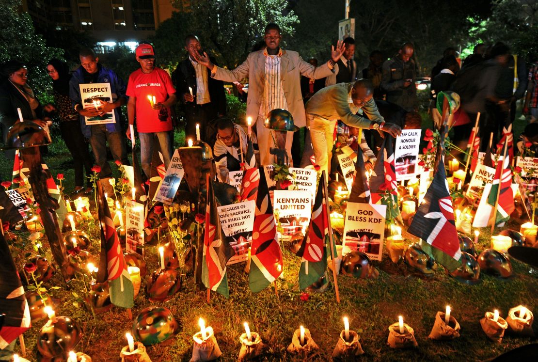 Kenyans in Nairobi pray at a candlelit vigil in honor of Kenyan soldiers on January 21, 2016. 