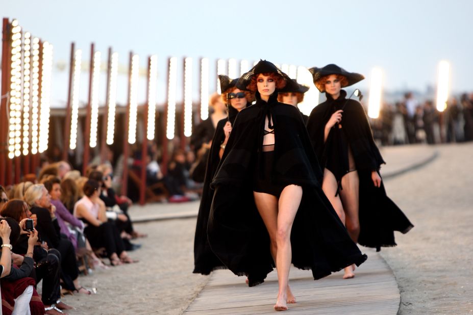 Around 350 guests reclined in sun beds, watching as the collection moved around the Venice lido at sunset.