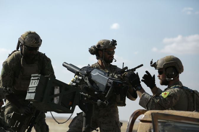 The Pentagon pushed back against the idea that the Americans were fighting. Here, the U.S. special operations forces ride in the back of a pickup truck in the village of Fatisah in the northern Syrian province of Raqqa on May 25, 2016.