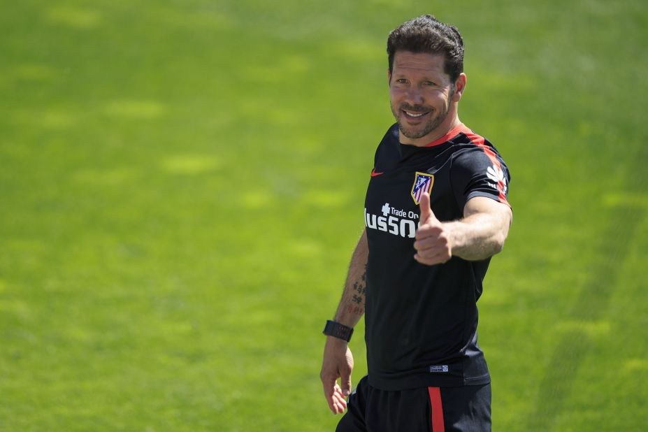 Atletico's head coach Diego Simeone gives the thumbs up during training ahead of the final. The team plays in the Argentine's image -- dogged, relentless and tenacious. Under him it broke the stranglehold of Barcelona and Real Madrid to win the Spanish League title in 2013.
