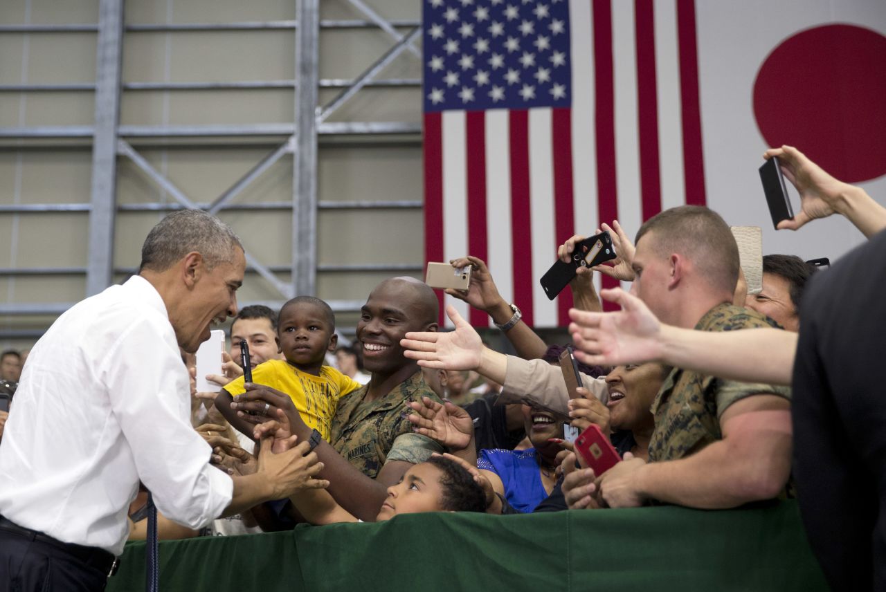 President Obama greets members of the U.S. and Japanese military as he arrives at Marine Corps Air Station Iwakuni in Iwakuni on May 27.