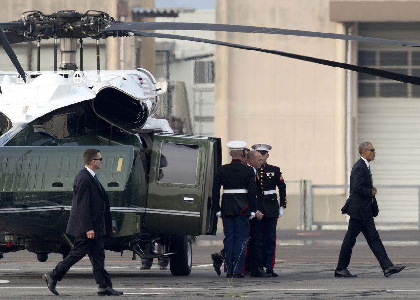 President Obama walks off Marine One at the landing zone in Hiroshima, western Japan.