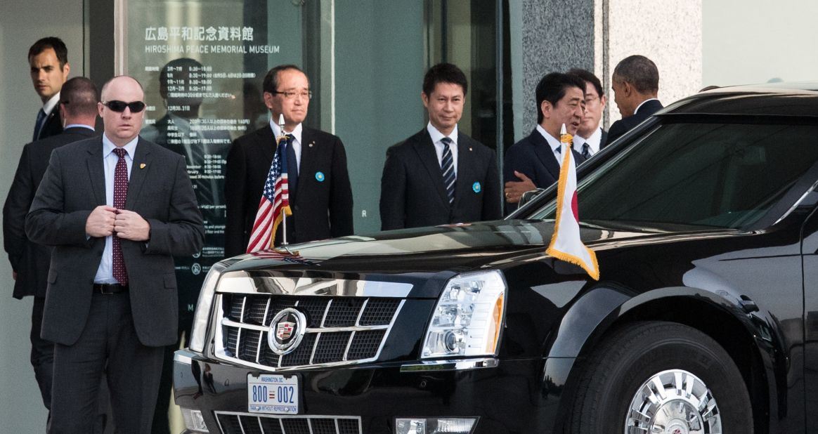 President  Obama, right, is greeted Japanese Prime Minister Shinzo Abe upon arriving at the Hiroshima Peace Memorial Park.