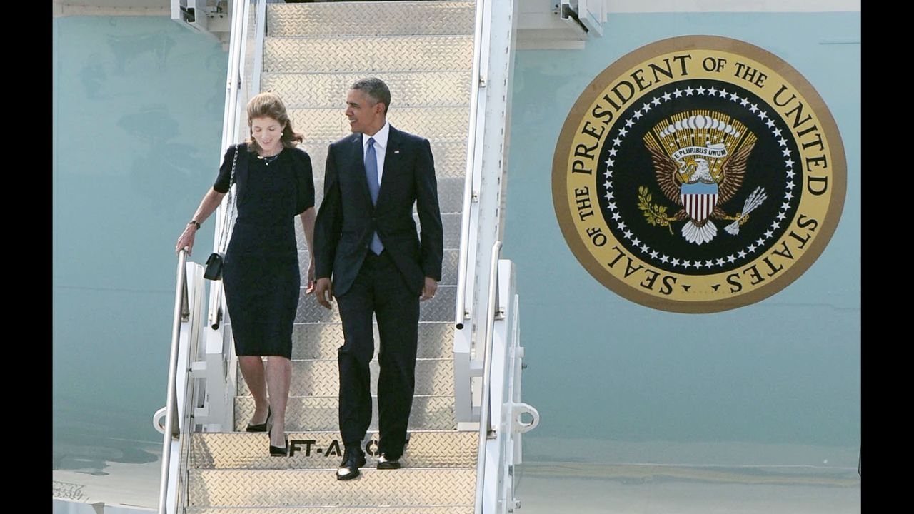 President Barack Obama and U.S. Ambassador to Japan Caroline Kennedy arrive at the Marine Corps' Air Station Iwakuni in the western Japanese city.