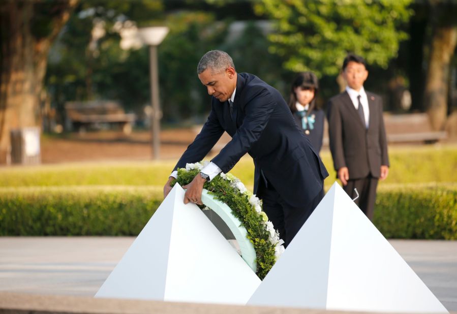 President Obama lays a wreath at Hiroshima Peace Memorial Park Friday.