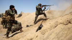 Iraqi government forces engage with ISIS forces near the village of al-Sejar, northeast of Falluja, on May 26.