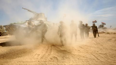 Iraqi government forces advance near al-Sejar on May 26.