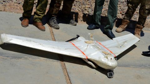 Iraqi security forces surround an ISIS drone that was shot down outside Falluja on May 26.