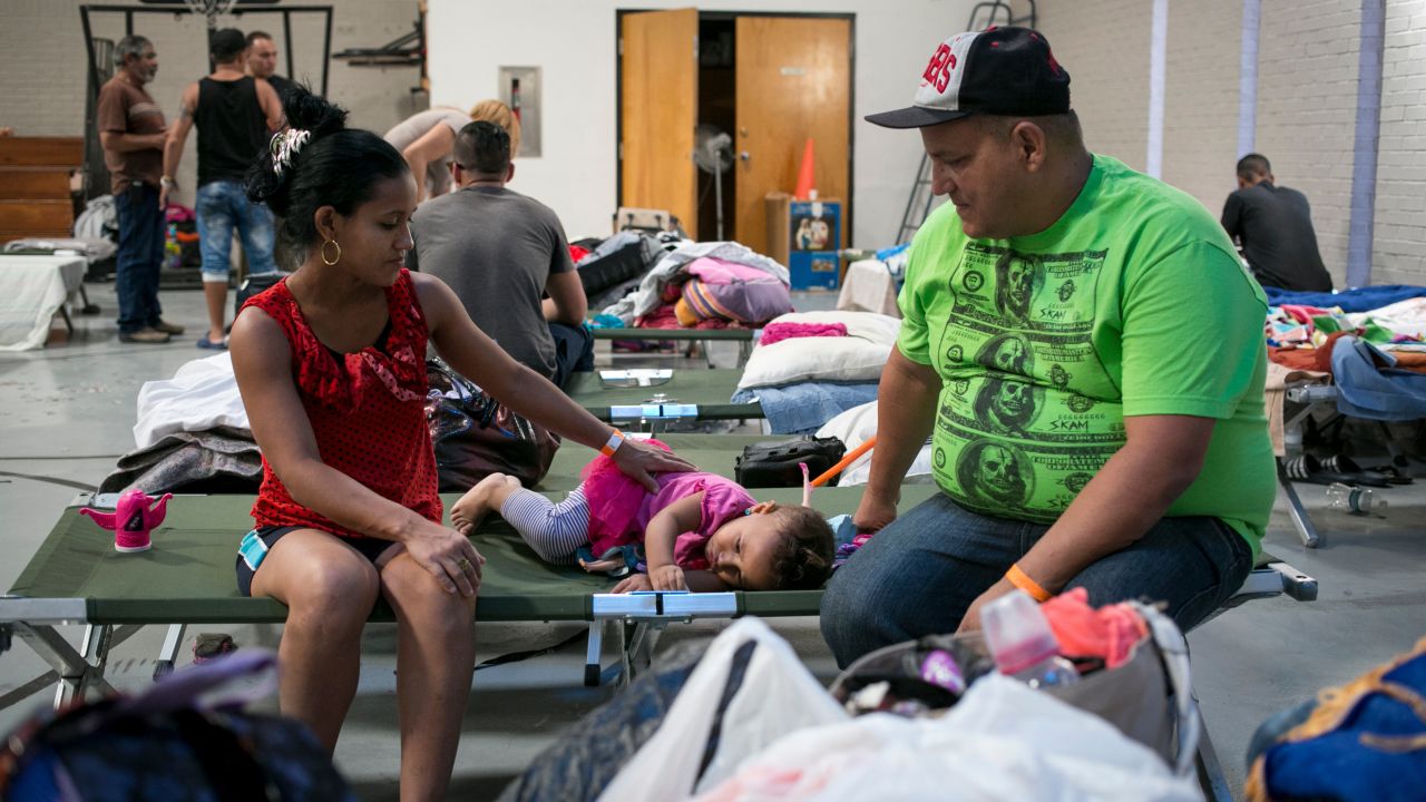 The Houchen Community Center in El Paso, Texas, gives food, clothing and shelter to Cubans streaming across the border, like Yadira Paloma Fombellida, 28, Julio Cesar Valle Hernandez, 36, and their daughter Angeline, 2. "We left so our children can have a future," Valle says. 