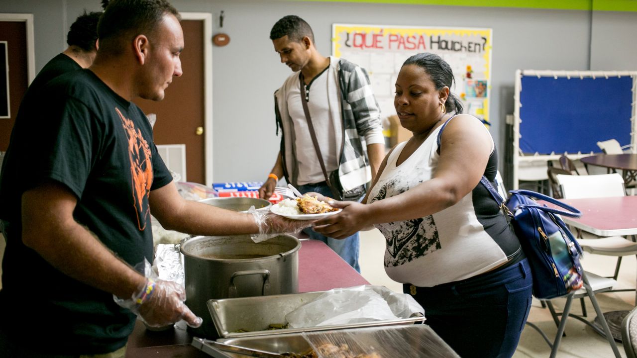 No matter what time the new immigrants arrive, Julio Rojas Rubio and other volunteers serve them a meal. Rojas, who crossed the border earlier in May, says he loves seeing the looks on his fellow Cubans' faces. "I feel good knowing that they have also achieved their dream of coming to the United States," he says.