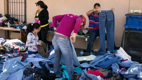 Piles of donated clothes are popular with Cubans who've just arrived at the Houchen Community Center. Many say their belongings were stolen as they traveled from Ecuador through Colombia and into Panama. 