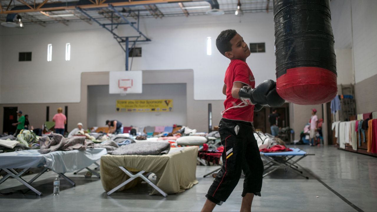 Yancarlos Rodriguez Castillo, 10, takes a break at the center while his father tries to figure out where the family will go next. 