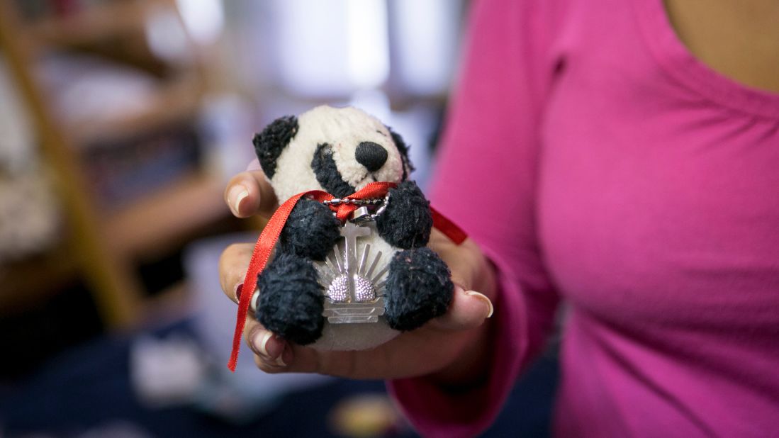 "When she gave me the bear, she told me she would always be with me," Yadira Lozano Odio, 31, said, her eyes welling up with tears as she described the moment she said goodbye to her best friend in Santiago de Cuba. Lozano keeps a necklace wrapped around the small stuffed panda -- a gift from another close friend. The necklace, she said, was blessed by a priest in her friend's church.