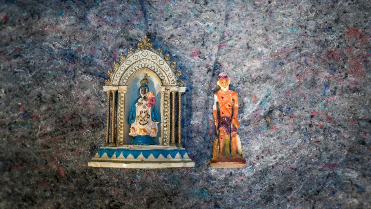Wrapped in clothes in a backpack he carried from Ecuador to the United States, Julio Cesar Valle Hernandez keeps small statues of the Virgen de la Regla (Our Lady of Regla) and San Lazaro (Saint Lazarus). "It got broken on the way," he said, "but I couldn't leave it behind."