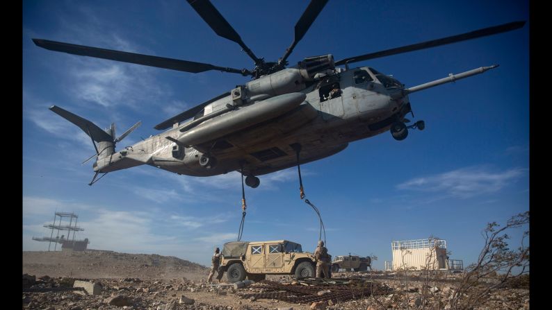 U.S. Marines anchor ropes to a Humvee during a training exercise in Twentynine Palms, California, on Friday, May 13.