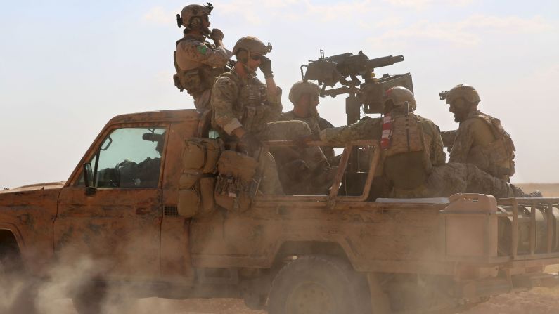 Armed men in uniform, identified by Syrian Democratic Forces as U.S. special operations forces, ride in the back of a pickup truck in the village of Fatisah, Syria, on Wednesday, May 25. The Pentagon <a href="index.php?page=&url=http%3A%2F%2Fwww.cnn.com%2F2016%2F05%2F26%2Fpolitics%2Fpentagon-syria-special-operations%2Findex.html" target="_blank">has pushed back on assertions</a> that the U.S. forces were fighting ISIS fighters alongside the Syrian forces they are advising. "Our forces in Iraq and Syria, their instructions, their mission, is clear that they are not at that leading edge," Pentagon press secretary Peter Cook told reporters. U.S. officials have maintained that their forces on the ground are only there to advise and assist local forces in their fight against ISIS.