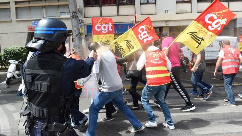 A riot police officer uses pepper spray on protestors in Marseille, France, at a rally against government's proposed labor law reforms, on May 25.
