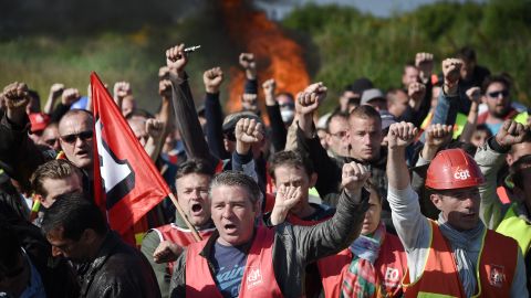 Workers strike and block access to an oil depot near the Total refinery in Donges, western France, on May 27 as the government proposes labor reforms that will tighten workers' rights.