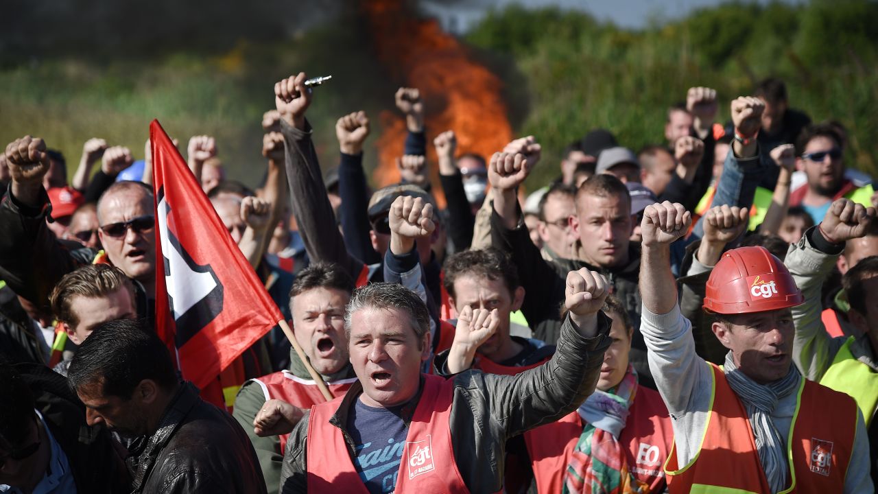 Workers strike and block access to an oil depot near the Total refinery in Donges, western France, on May 27 as the government proposes labor reforms that will tighten workers' rights. 
