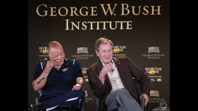 Former U.S. President George W. Bush, right, and Air Force Master Sgt. Israel Del Toro Jr. laugh at a joke during an Invictus Games symposium on Sunday, May 8. The Invictus Games, which took place in Florida this year, were created by Britain's Prince Harry for wounded, injured and sick service members. Fifteen countries competed in the sports competition this year.