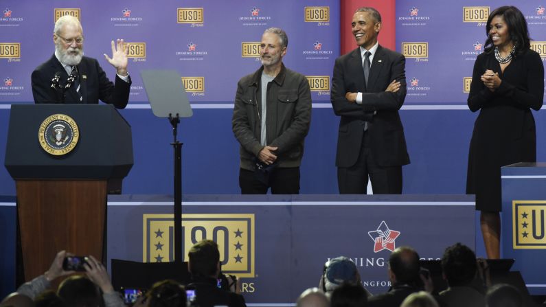 Former talk-show host David Letterman speaks during the 75th Anniversary USO Show on Thursday, May 5. Joining him on stage, from left, are host Jon Stewart, U.S. President Barack Obama and first lady Michelle Obama.