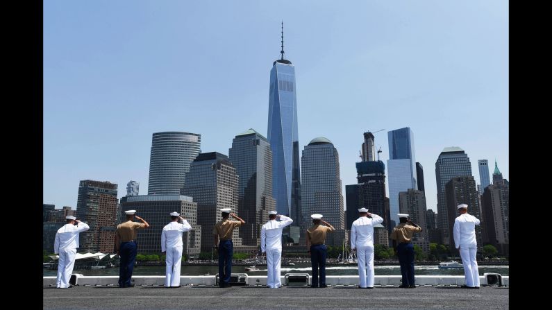 Sailors and Marines aboard the USS Bataan salute as the ship pulls into New York for Fleet Week celebrations on Wednesday, May 25. <a href="index.php?page=&url=http%3A%2F%2Fwww.cnn.com%2F2016%2F05%2F04%2Fus%2Fgallery%2Fus-military-april-photos%2Findex.html" target="_blank">See U.S. military photos from April</a>