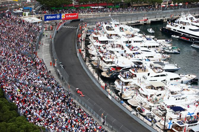 The rich and famous watch the race from yachts lining the harbor.  