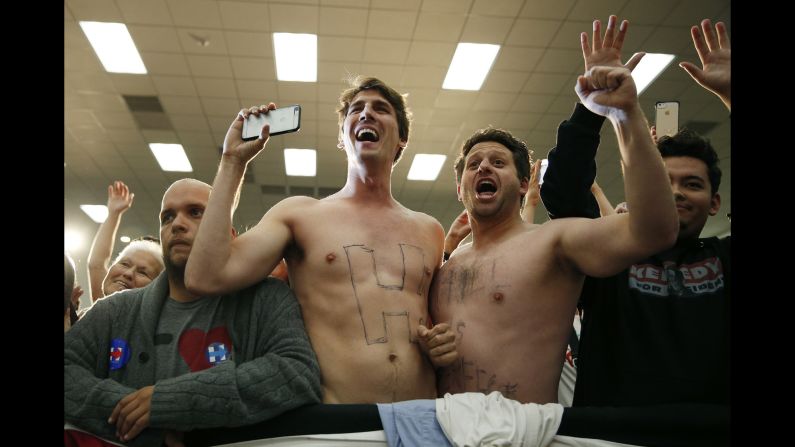 Shirtless men cheer for Democratic presidential candidate Hillary Clinton at a campaign event in Buena Park, California, on Wednesday, May 25.